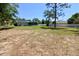 Spacious backyard featuring a well-maintained lawn and secure white fencing at 13180 Lawrence St, Spring Hill, FL 34609
