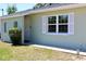 Close up of exterior with large window and green grass at 13180 Lawrence St, Spring Hill, FL 34609