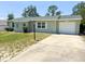 Charming single-story home with a well-maintained front yard and attached one car garage at 13180 Lawrence St, Spring Hill, FL 34609