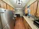 Spacious kitchen with stainless steel appliances and access to laundry room at 13180 Lawrence St, Spring Hill, FL 34609