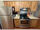 Kitchen with stainless steel refrigerator and modern oven and range at 13180 Lawrence St, Spring Hill, FL 34609