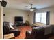 Inviting living room featuring sleek hardwood floors and cozy seating arrangements at 13180 Lawrence St, Spring Hill, FL 34609