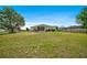 Expansive backyard featuring lush greenery, providing ample space for outdoor activities and relaxation at 13317 Pinellas Ave, Spring Hill, FL 34609
