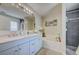 Bright bathroom featuring a double vanity, soaking tub and walk-in shower at 13317 Pinellas Ave, Spring Hill, FL 34609