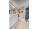 Bright bathroom featuring a double vanity, soaking tub and walk-in shower at 13317 Pinellas Ave, Spring Hill, FL 34609