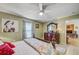 Comfortable bedroom with a decorative bed frame, a large dresser, and a serene, inviting atmosphere at 13317 Pinellas Ave, Spring Hill, FL 34609