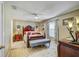 Bedroom featuring a large bed, matching nightstands, and decor at 13317 Pinellas Ave, Spring Hill, FL 34609