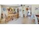 Charming dining area featuring hardwood floors, vintage decor, and access to the rest of the home at 13317 Pinellas Ave, Spring Hill, FL 34609