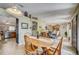 Inviting dining area with hardwood floors, natural light, and seamless flow into adjacent rooms at 13317 Pinellas Ave, Spring Hill, FL 34609