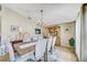 Charming dining room featuring a chandelier, a large dining table, and natural light at 13317 Pinellas Ave, Spring Hill, FL 34609