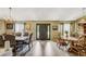 Open-concept dining room with a beautiful chandelier and elegant dining furniture at 13317 Pinellas Ave, Spring Hill, FL 34609