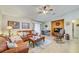 Comfortable living room with tile flooring, cozy furniture, and bright natural lighting at 13317 Pinellas Ave, Spring Hill, FL 34609