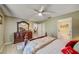 Comfortable main bedroom with a decorative dresser and an ensuite bathroom at 13317 Pinellas Ave, Spring Hill, FL 34609