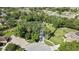 Expansive aerial view showcasing property and verdant landscaping at 13460 Pia Ct, Spring Hill, FL 34609