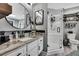Bathroom featuring a modern vanity with granite countertops and a sleek glass-enclosed shower at 13460 Pia Ct, Spring Hill, FL 34609