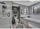 Inviting bathroom with a separate glass shower and a luxurious soaking tub under a stained glass window at 13460 Pia Ct, Spring Hill, FL 34609