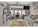 Bright bedroom featuring large windows, a built-in desk, and a charming floral rug, perfect for a personal space at 13460 Pia Ct, Spring Hill, FL 34609