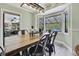Relaxing dining room with farmhouse table and natural light coming in from bay window at 13460 Pia Ct, Spring Hill, FL 34609