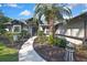 The house has a decorative front entrance, enhanced by a lush garden and a winding pathway at 13460 Pia Ct, Spring Hill, FL 34609