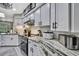 Well-lit kitchen with stainless steel appliances and granite countertops at 13460 Pia Ct, Spring Hill, FL 34609