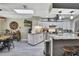 Bright kitchen featuring stainless steel appliances, white cabinets, and light countertops at 13460 Pia Ct, Spring Hill, FL 34609