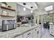 Spacious kitchen with modern cabinets, updated countertops and lighting at 13460 Pia Ct, Spring Hill, FL 34609