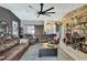 Inviting living room featuring a wood accent wall and comfortable leather seating at 13460 Pia Ct, Spring Hill, FL 34609