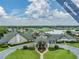 Stunning aerial view of the community clubhouse overlooking the beautiful golf course and lake at 1407 Hickory Moss Pl, Trinity, FL 34655