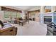 Open concept living room featuring sliding glass doors, a fireplace, and carpeted floors at 1407 Hickory Moss Pl, Trinity, FL 34655