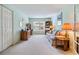 Inviting living space with a cozy sofa, desk, and bright window, perfect for relaxing or working at 1407 Hickory Moss Pl, Trinity, FL 34655
