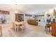 Bright living area featuring neutral walls, carpet, fireplace, and ample seating at 1407 Hickory Moss Pl, Trinity, FL 34655