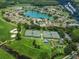 Aerial view of the tennis courts and surrounding community amenities at 1407 Hickory Moss Pl, Trinity, FL 34655