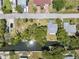 Overhead view features the street and backyard canal access of this house with surrounding greenery at 14220 Hendry Ct, Hudson, FL 34667