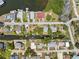 Aerial view showing canal access homes on both sides of a street at 14220 Hendry Ct, Hudson, FL 34667