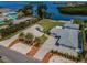 Stunning waterfront property with lush landscaping and a private beach at 1620 Sea Breeze Dr, Tarpon Springs, FL 34689