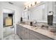 This bathroom features a double sink with marble countertops and modern fixtures at 1620 Sea Breeze Dr, Tarpon Springs, FL 34689