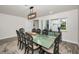 Stylish dining room features modern chandelier, large table, and contemporary decor at 1620 Sea Breeze Dr, Tarpon Springs, FL 34689