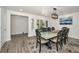 Dining room with unique table, modern chandelier, and open access to other living areas at 1620 Sea Breeze Dr, Tarpon Springs, FL 34689
