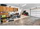 Organized garage with wooden cabinets, workbench, and ample storage space at 1620 Sea Breeze Dr, Tarpon Springs, FL 34689
