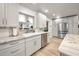 Bright kitchen with modern appliances, marble countertops and light cabinetry at 1620 Sea Breeze Dr, Tarpon Springs, FL 34689