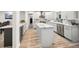 Modern kitchen boasts marble countertops, stainless appliances and stylish cabinetry at 1620 Sea Breeze Dr, Tarpon Springs, FL 34689