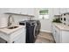 Laundry room with modern appliances, ample cabinet space, and stylish finishes at 1620 Sea Breeze Dr, Tarpon Springs, FL 34689
