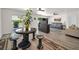 Bright living room featuring modern decor, hardwood floors, and sliding glass doors to the patio at 1620 Sea Breeze Dr, Tarpon Springs, FL 34689