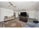 Open-concept living room featuring modern design, hardwood floors, and access to the kitchen at 1620 Sea Breeze Dr, Tarpon Springs, FL 34689