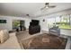 Bright living room with a view to the outside patio and backyard at 1620 Sea Breeze Dr, Tarpon Springs, FL 34689