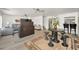 Spacious living room boasting light hardwood floors, neutral paint, and stairs leading to other floors at 1620 Sea Breeze Dr, Tarpon Springs, FL 34689