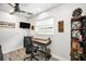 Cozy home office featuring modern décor, sleek wood floors, and a ceiling fan at 1620 Sea Breeze Dr, Tarpon Springs, FL 34689