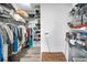 Organize your wardrobe in this walk-in closet with shelving and ample hanging space at 1620 Sea Breeze Dr, Tarpon Springs, FL 34689