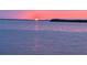 Sunset over the ocean reflecting off calm waters, creating a peaceful atmosphere at 1620 Sea Breeze Dr, Tarpon Springs, FL 34689