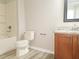 Bathroom featuring a vanity, tub, and toilet at 19551 Timberbluff Dr, Land O Lakes, FL 34638